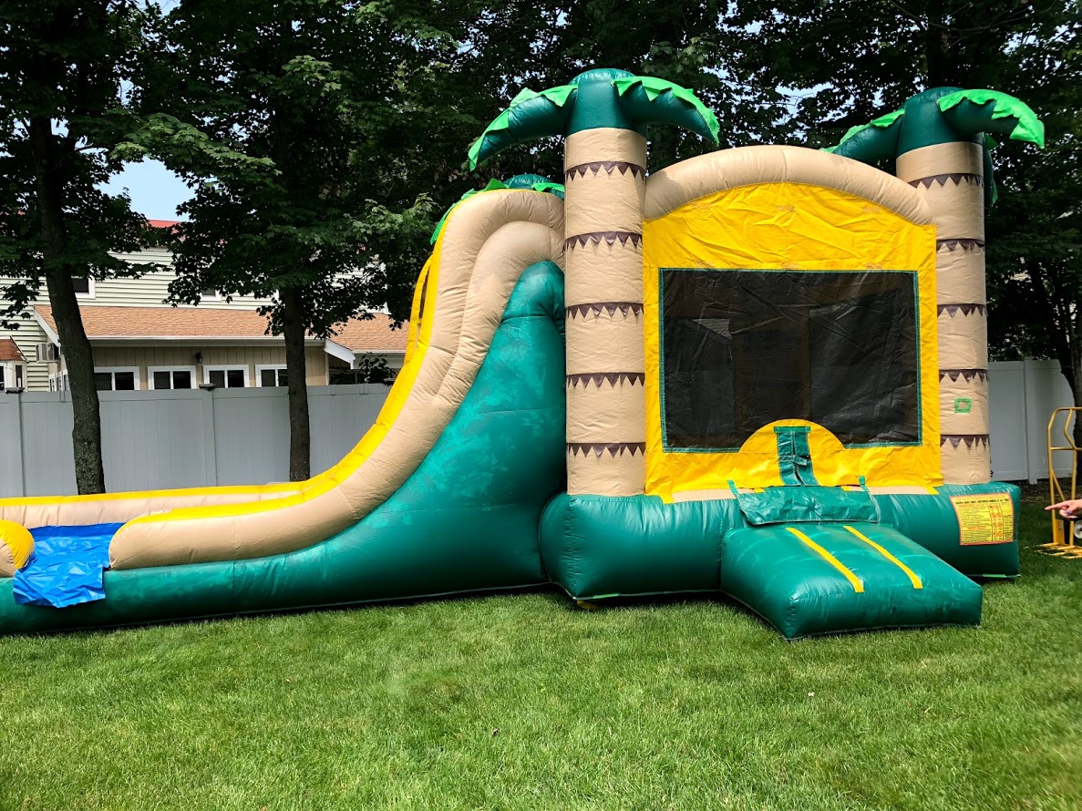 Kids jumping in a colorful bouncy house