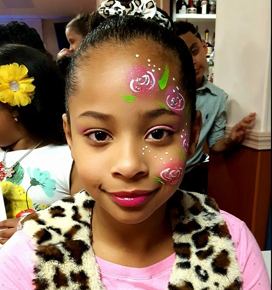 Child with beautiful butterfly face paint